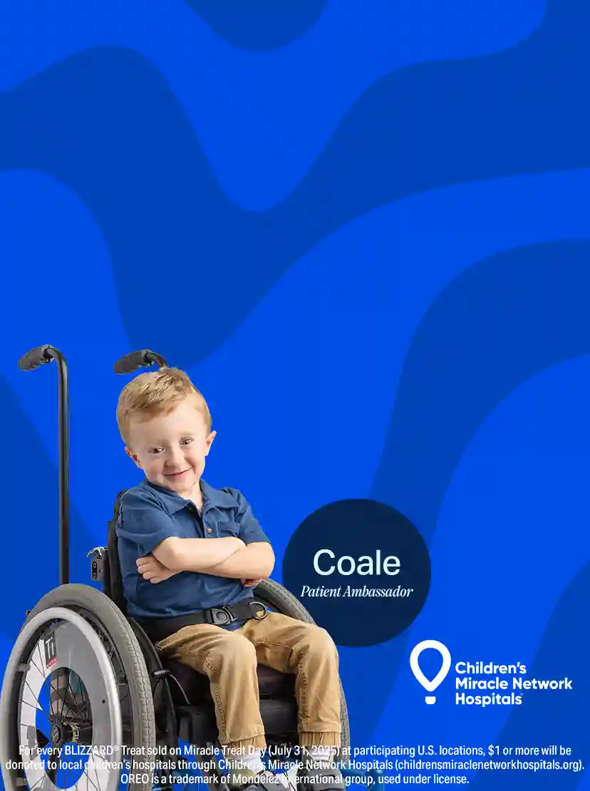 Girl standing in front of a Dairy Queen store