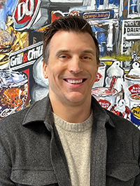 employee standing in front of a wall