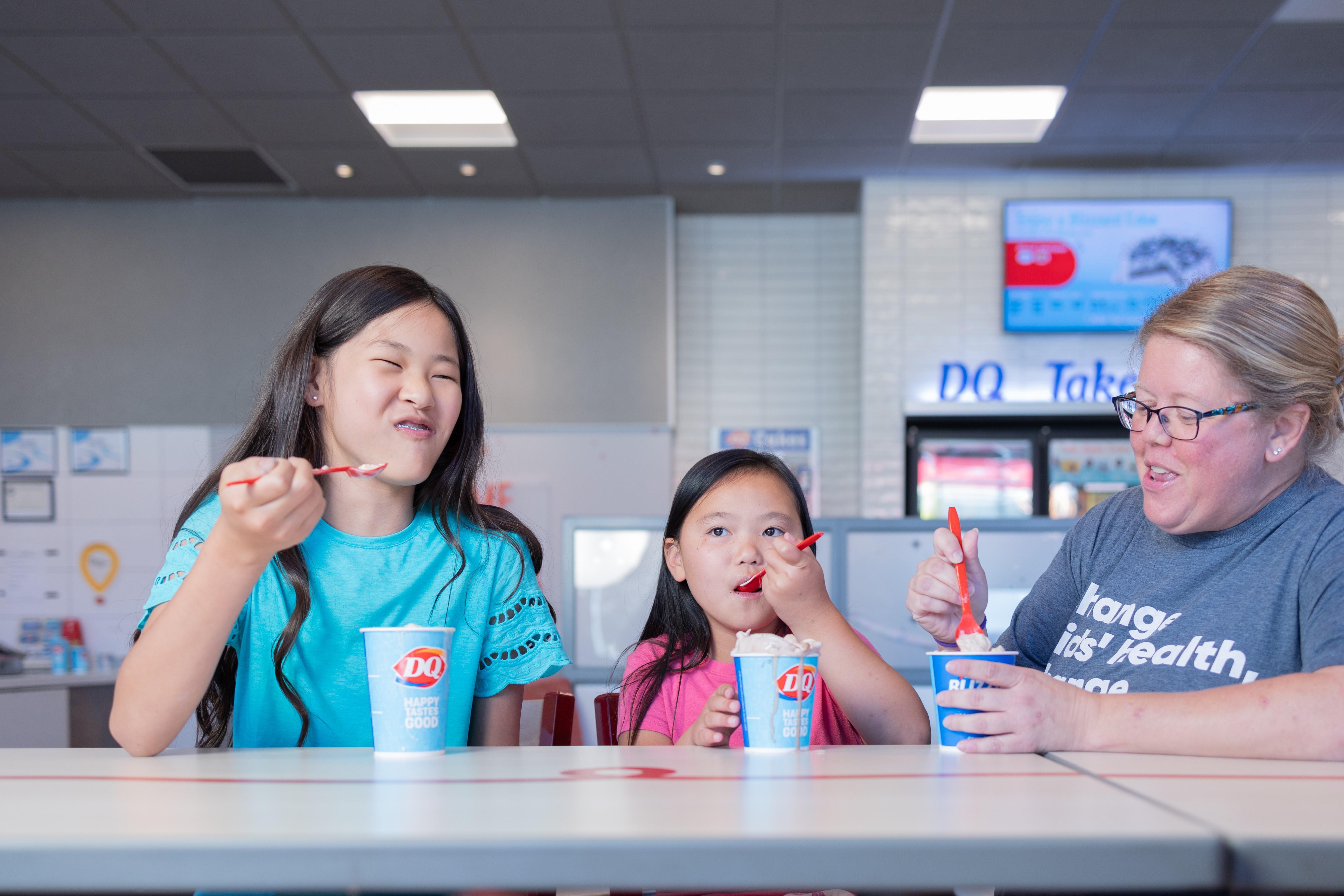 Two children enjoying a DQ Blizzard Treat