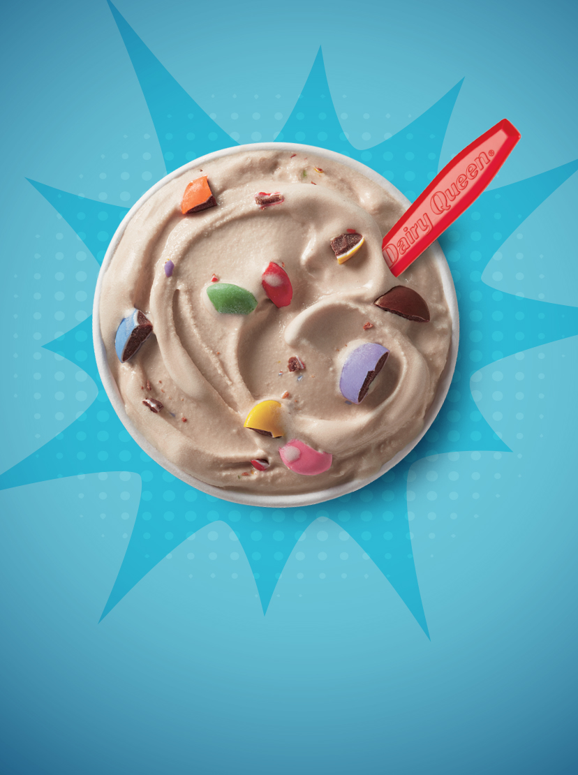 Overhead image of smarties blizzard and DQ red spoon